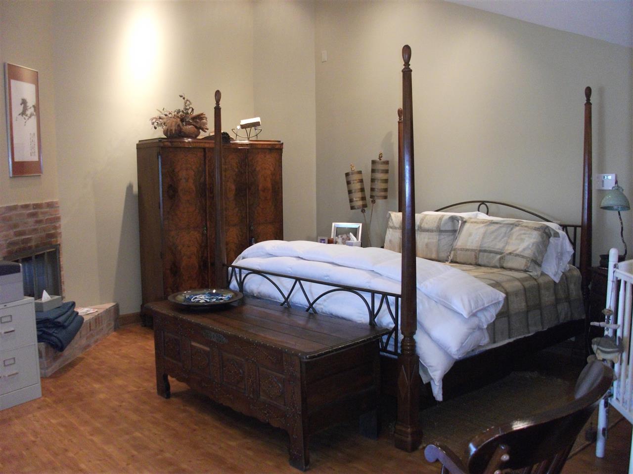 200 Eagle View Drive Cherokee, AL 35616 - Photo 10 of 34 a bedroom with a bed and wooden floor