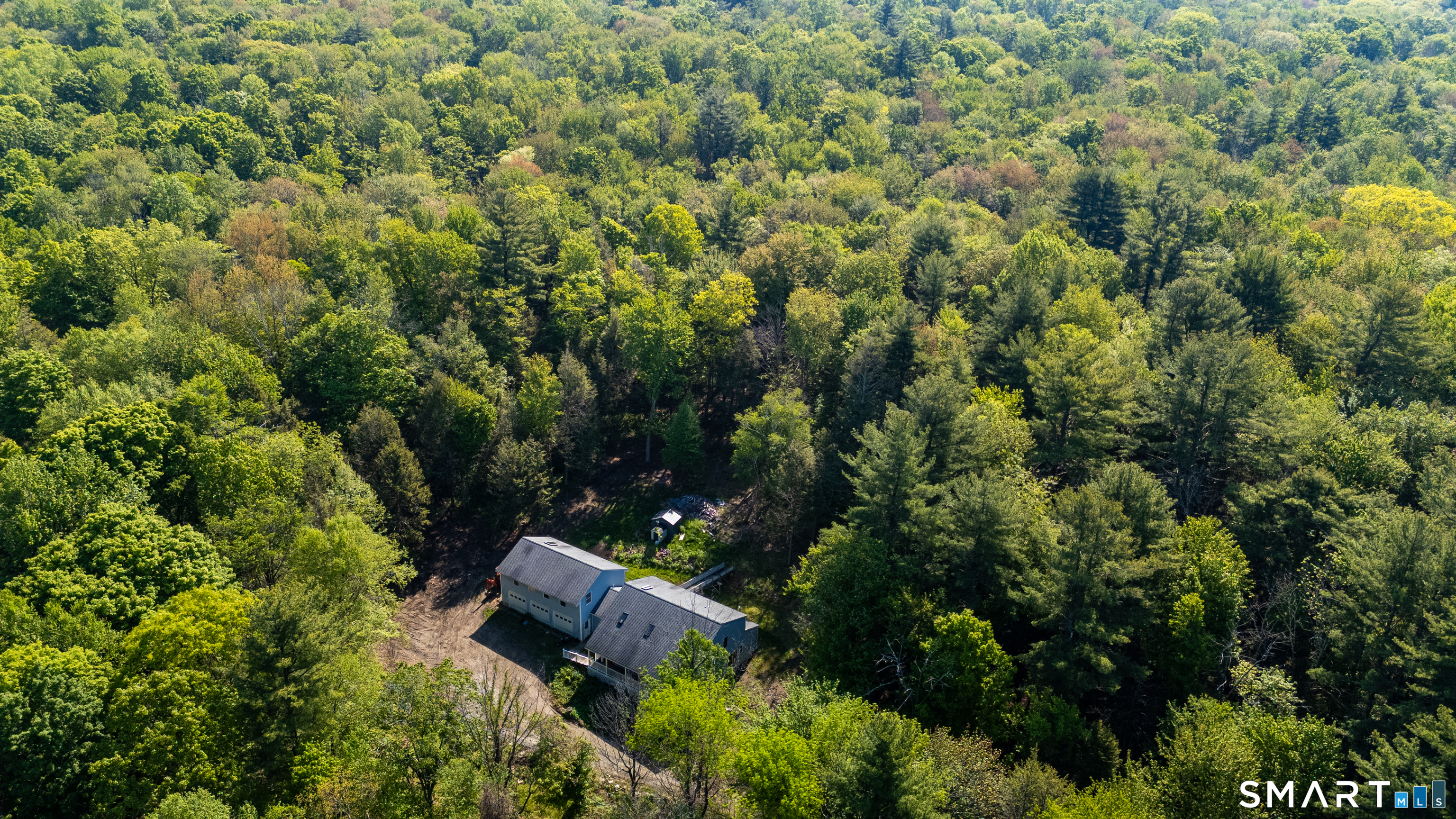315 West Hill Road Torrington, CT 06790 - Photo 28 of 40 an aerial view of a house with a yard