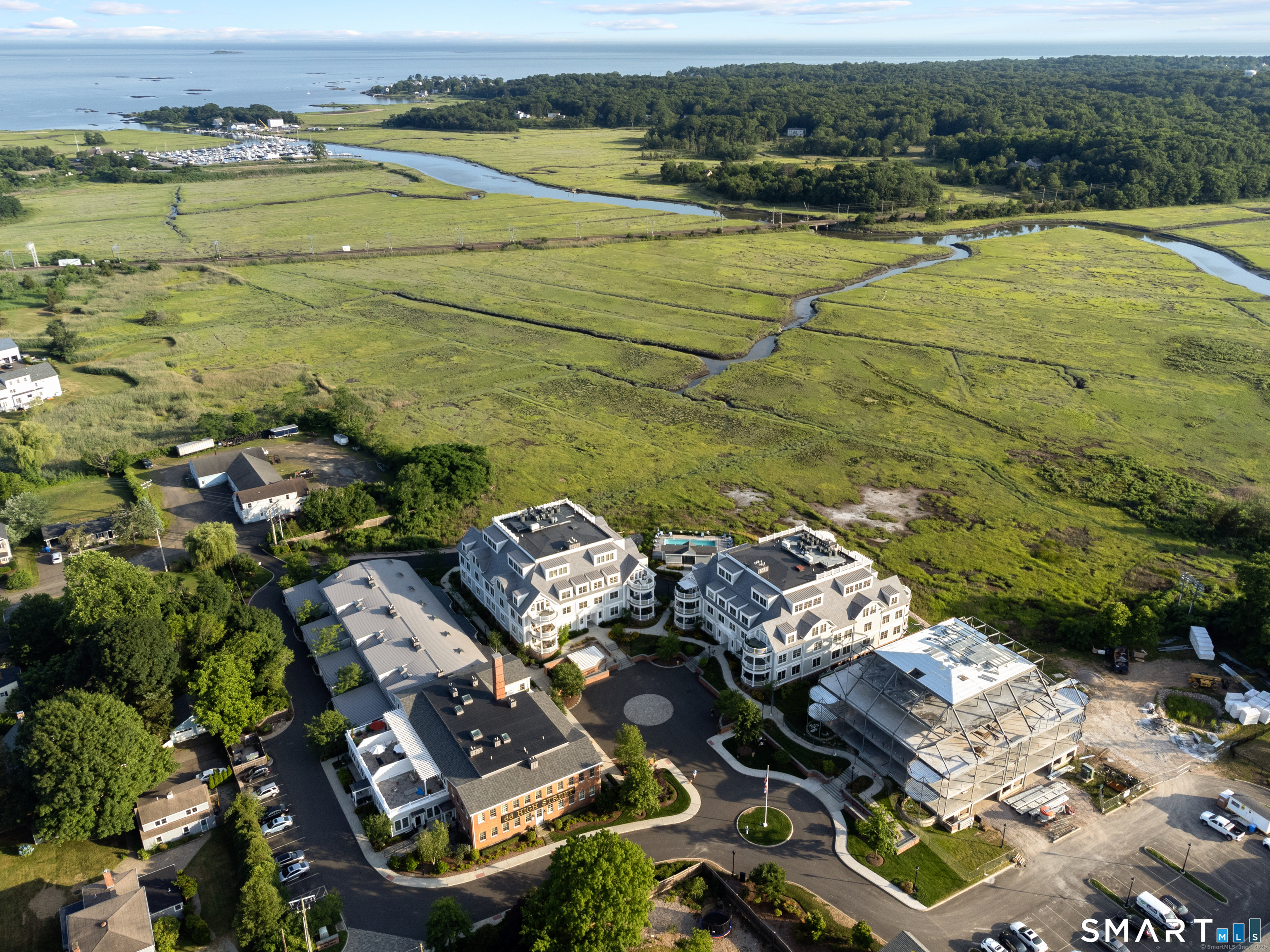 Aerial view of The Residences of 66 High Street with the West River, Guilford Yacht Club, Jacobs Beach and Long Island Sound in the background.