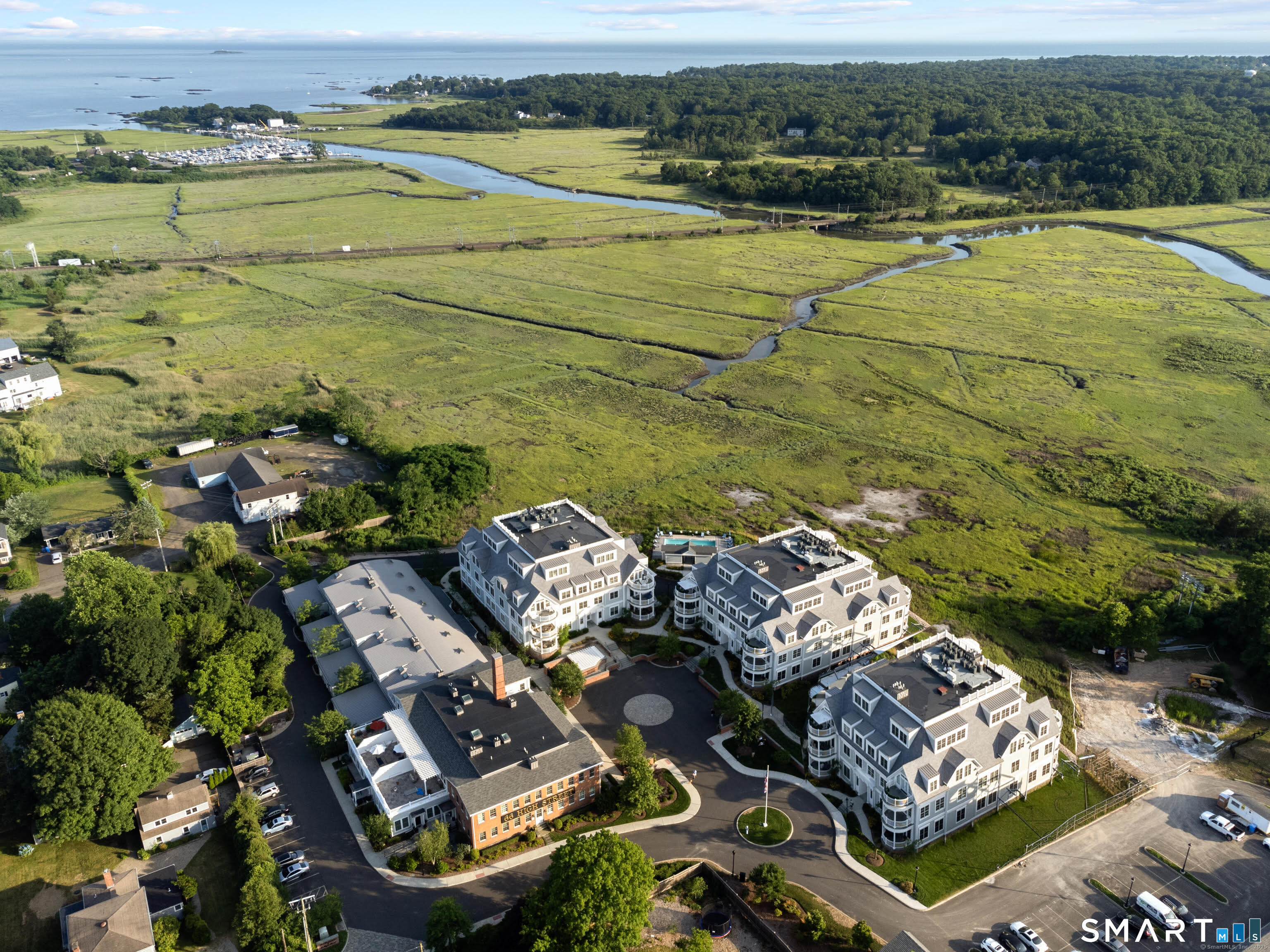 an aerial view of a residential houses with outdoor space