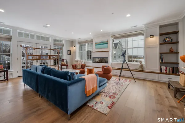 a living room with furniture and a rug