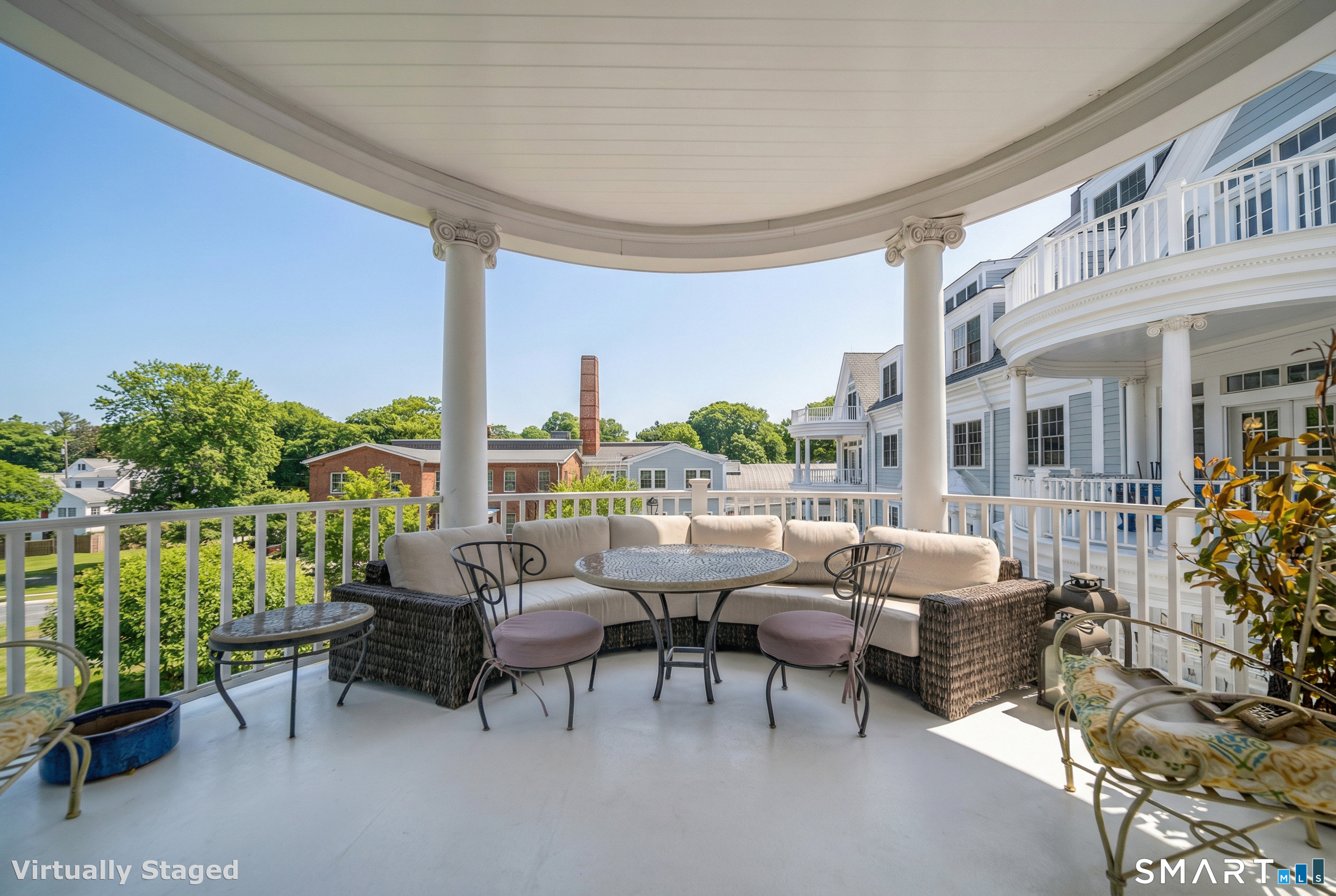 66 High Street, Unit 34 Guilford, CT 06437 - Photo 19 of 40 a living room with patio furniture and a potted plants