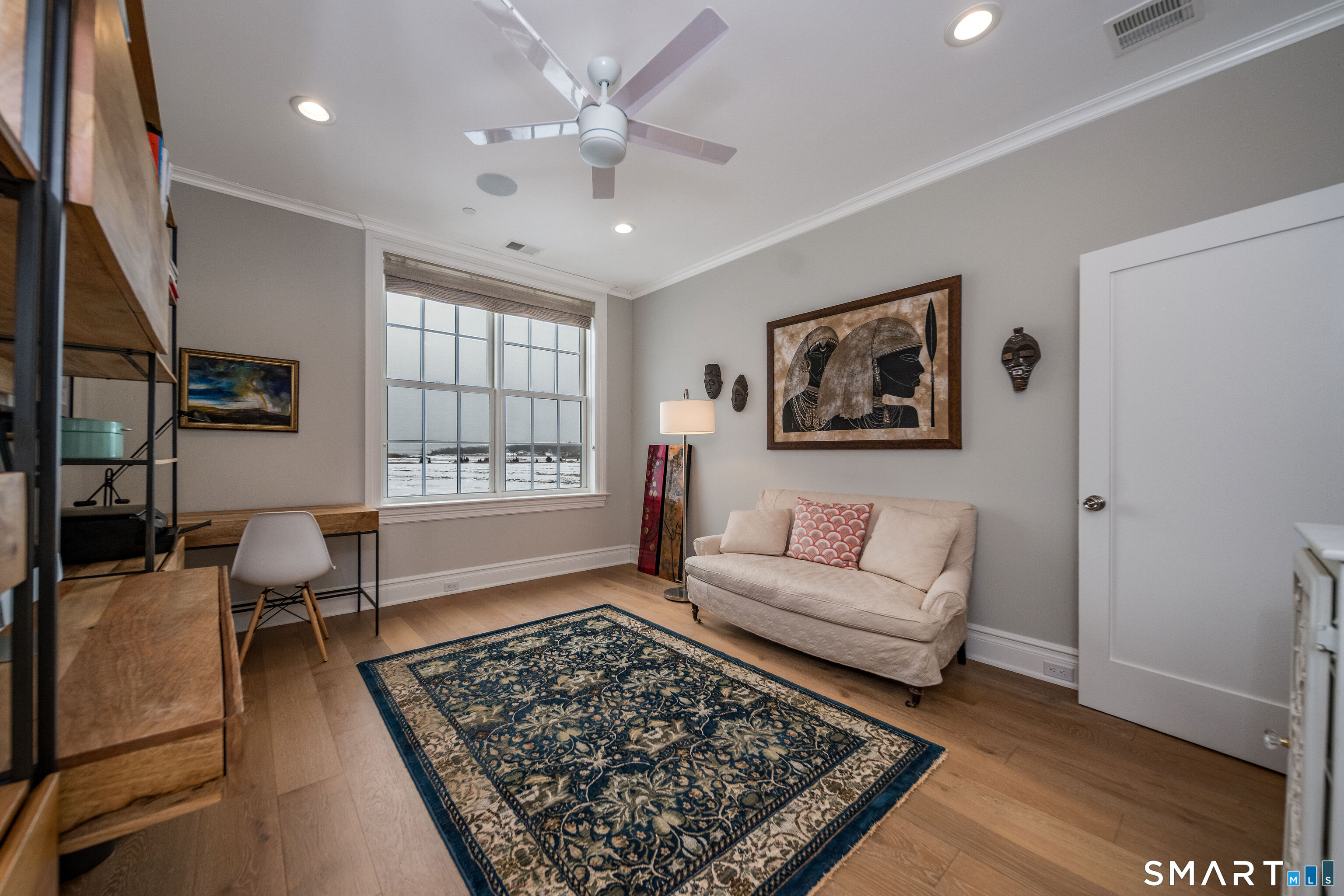 66 High Street, Unit 34 Guilford, CT 06437 - Photo 21 of 40 a living room with furniture and a rug