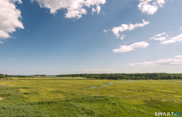 a view of a lake with furniture