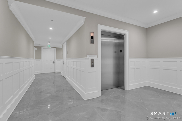 66 High Street, Unit 34 Guilford, CT 06437 - Photo 6 of 39 Elevator that begins in the parking garage bringing residents to all four floors.