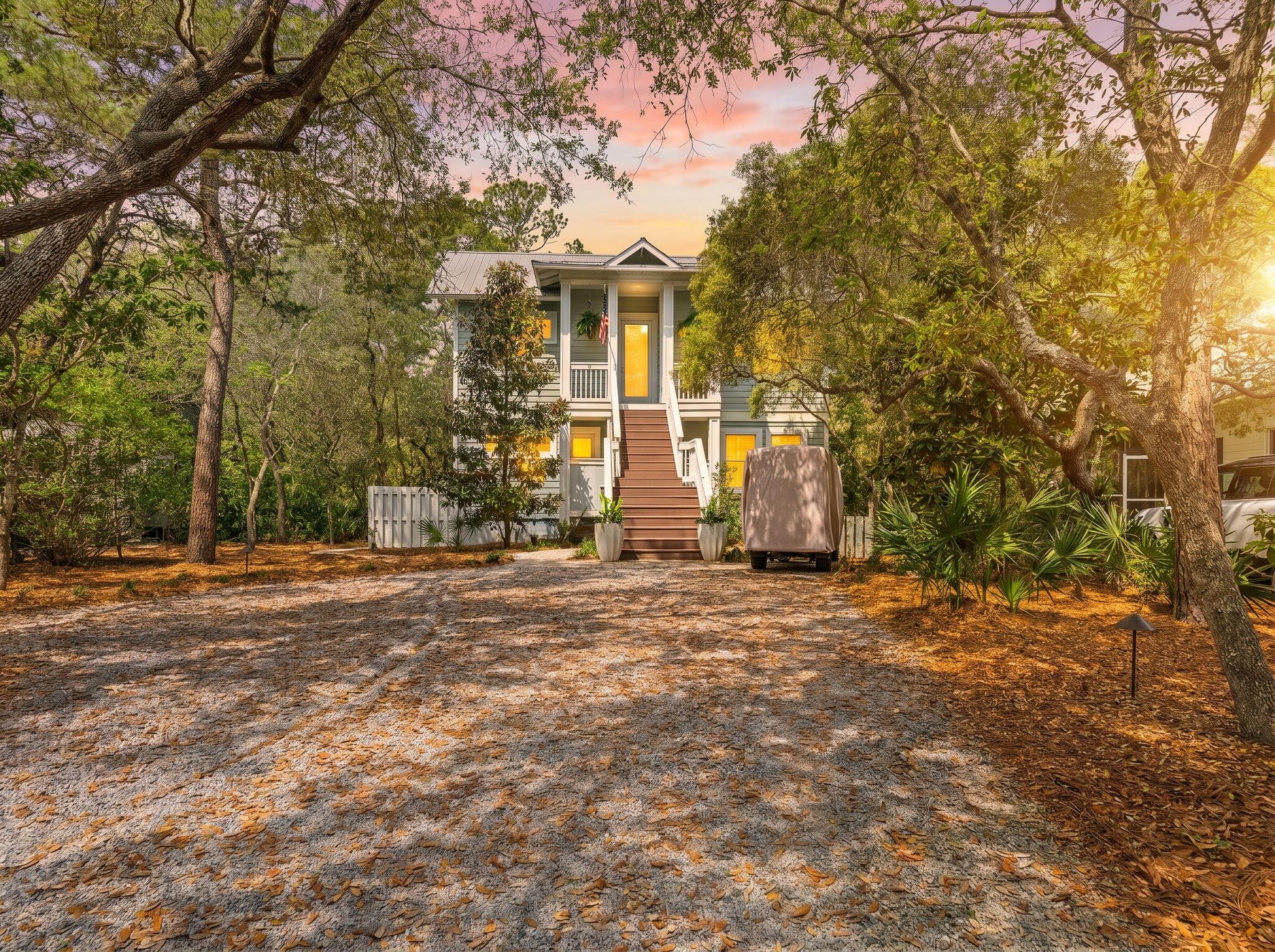353 Wilderness Way Santa Rosa Beach, FL 32459 - Photo 1 of 50 a front view of a house with a yard