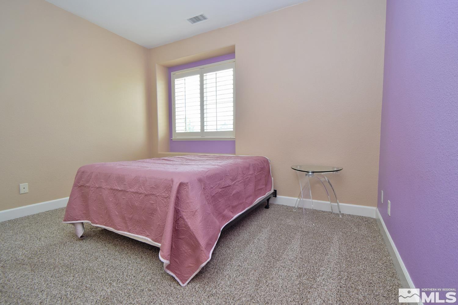 410 Teramo Court Reno, NV 89521 - Photo 16 of 32 a bedroom with a bed and window