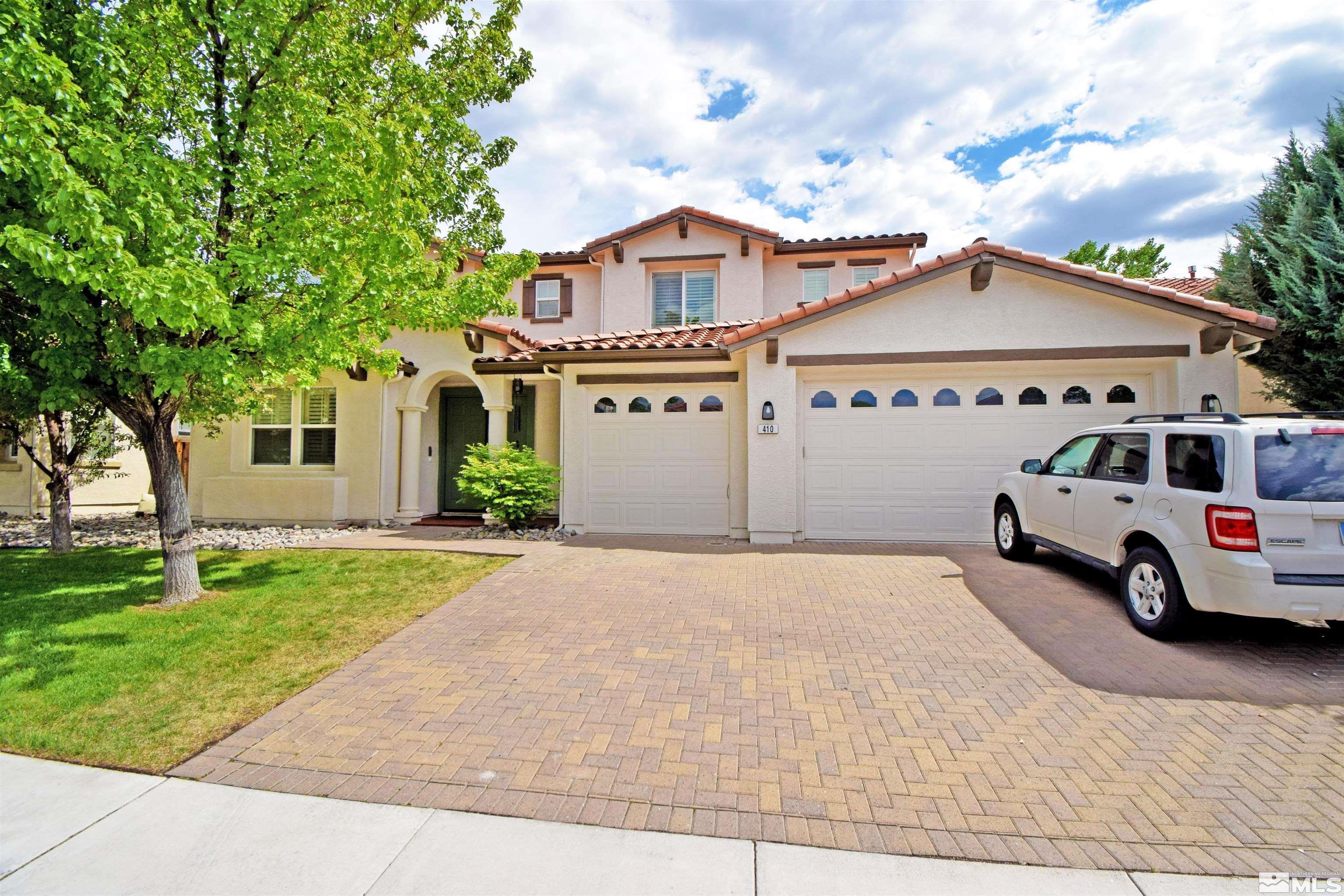 410 Teramo Court Reno, NV 89521 - Photo 2 of 32 a view of multiple houses with a yard