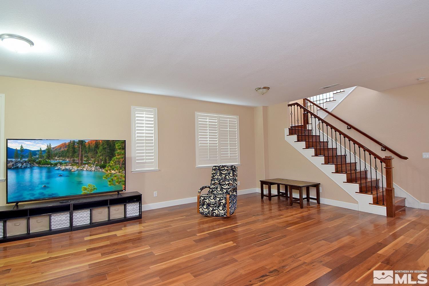 410 Teramo Court Reno, NV 89521 - Photo 24 of 32 a living room with furniture and a flat screen tv