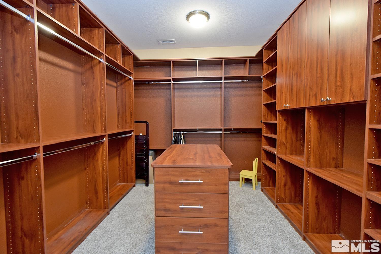 410 Teramo Court Reno, NV 89521 - Photo 25 of 32 a storage room with wooden walls and stairs