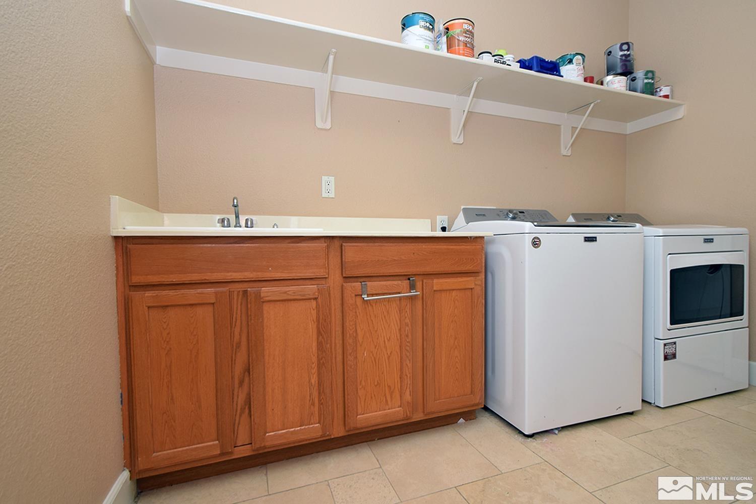 410 Teramo Court Reno, NV 89521 - Photo 27 of 32 a utility room with dryer and washer