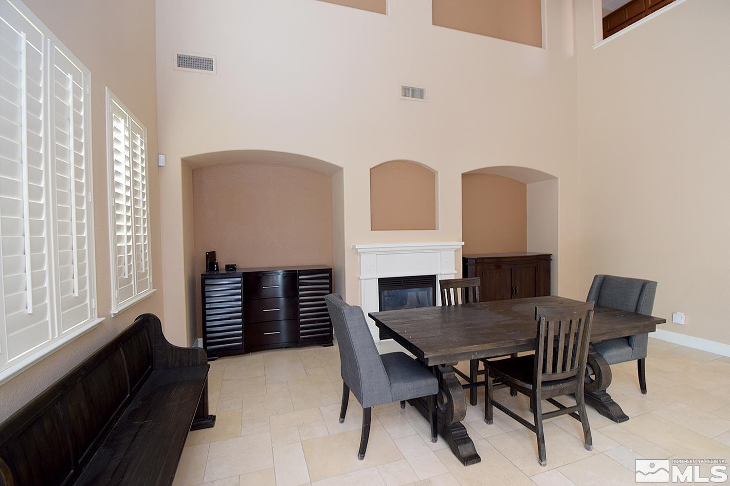 410 Teramo Court Reno, NV 89521 - Photo 8 of 32 a view of a dining room with furniture window and outside view