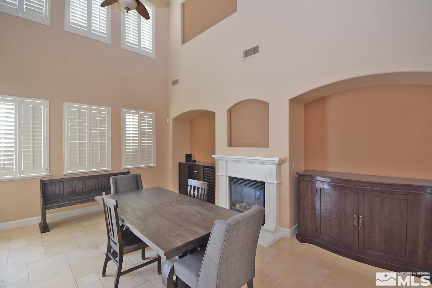 410 Teramo Court Reno, NV 89521 - Photo 9 of 32 a view of a livingroom with furniture and fireplace
