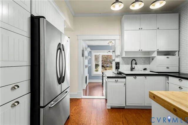 a view of a livingroom with a fireplace and window
