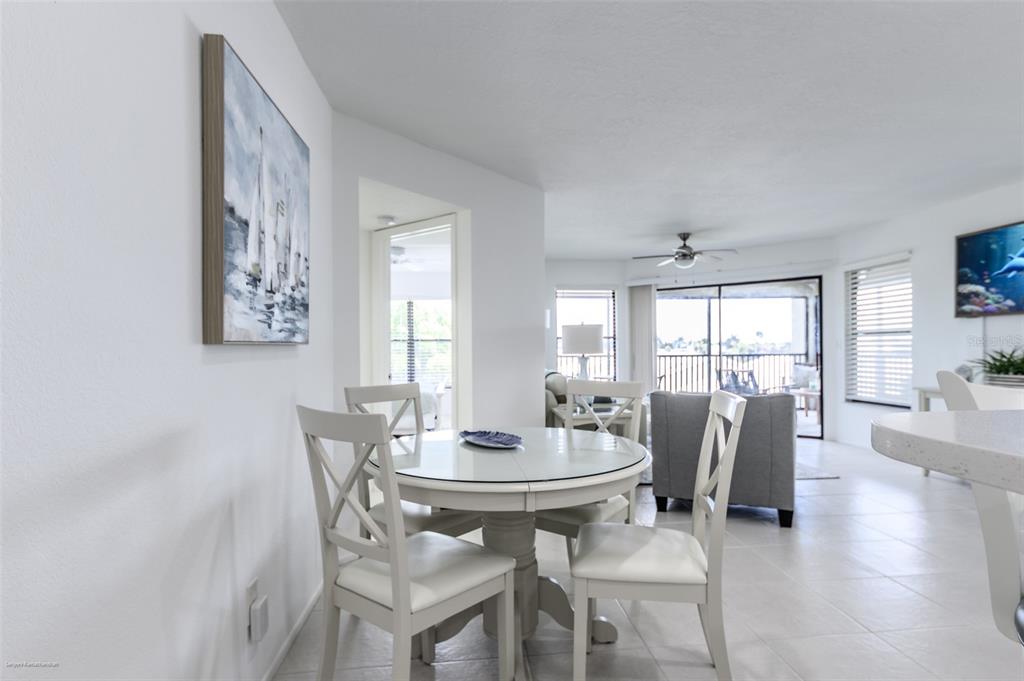 2601 West Marion Avenue, Unit 41C Punta Gorda, FL 33950 - Photo 13 of 43 a view of a dining room with furniture and wooden floor