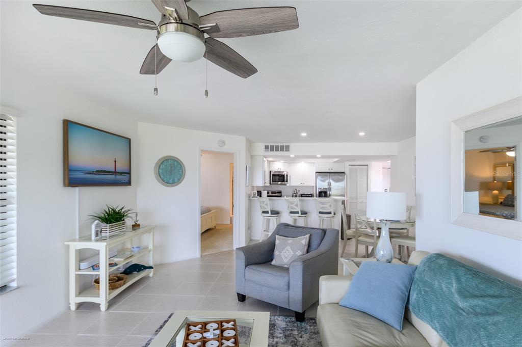 2601 West Marion Avenue, Unit 41C Punta Gorda, FL 33950 - Photo 16 of 43 a living room with furniture and a view of kitchen