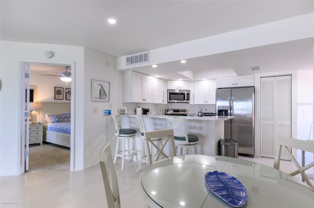 2601 West Marion Avenue, Unit 41C Punta Gorda, FL 33950 - Photo 18 of 43 a living room with stainless steel appliances kitchen island granite countertop furniture and a view of kitchen