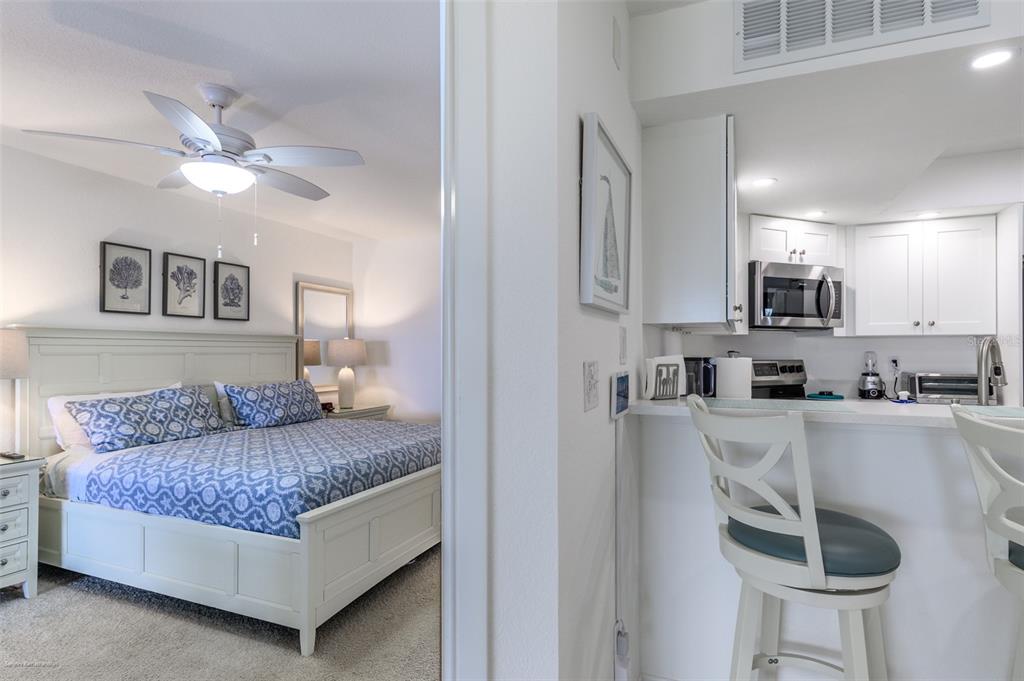 2601 West Marion Avenue, Unit 41C Punta Gorda, FL 33950 - Photo 19 of 43 a living room with furniture and a kitchen