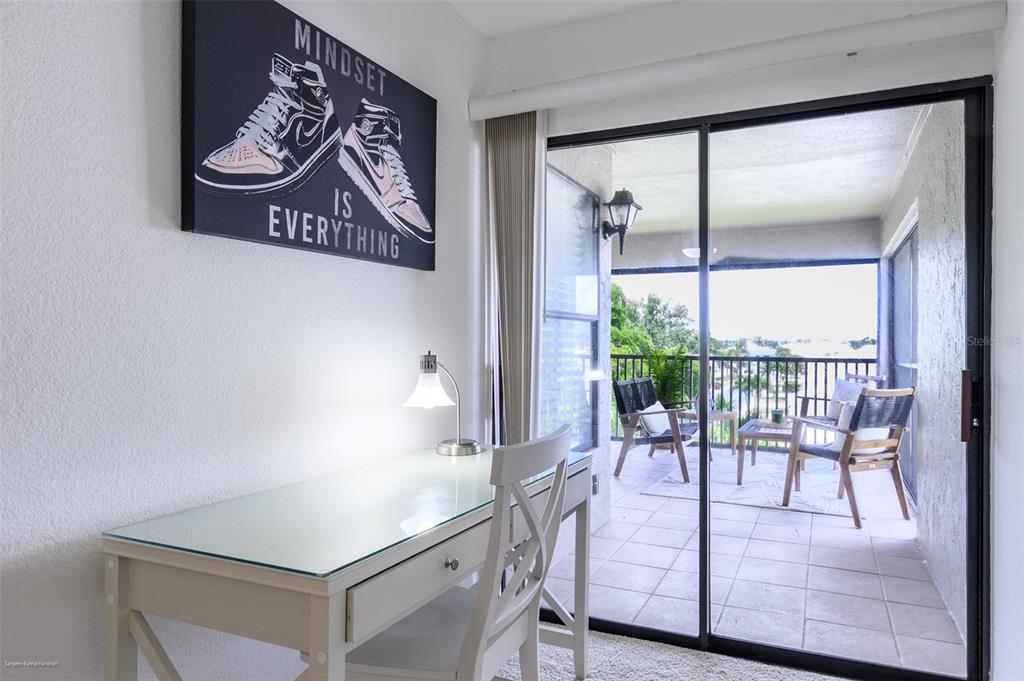 2601 West Marion Avenue, Unit 41C Punta Gorda, FL 33950 - Photo 25 of 43 a view of a room with furniture and large windows