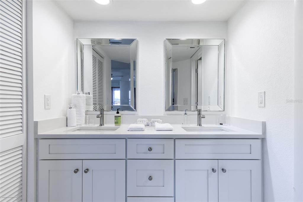2601 West Marion Avenue, Unit 41C Punta Gorda, FL 33950 - Photo 28 of 43 a bathroom with double vanity sinks and a mirror