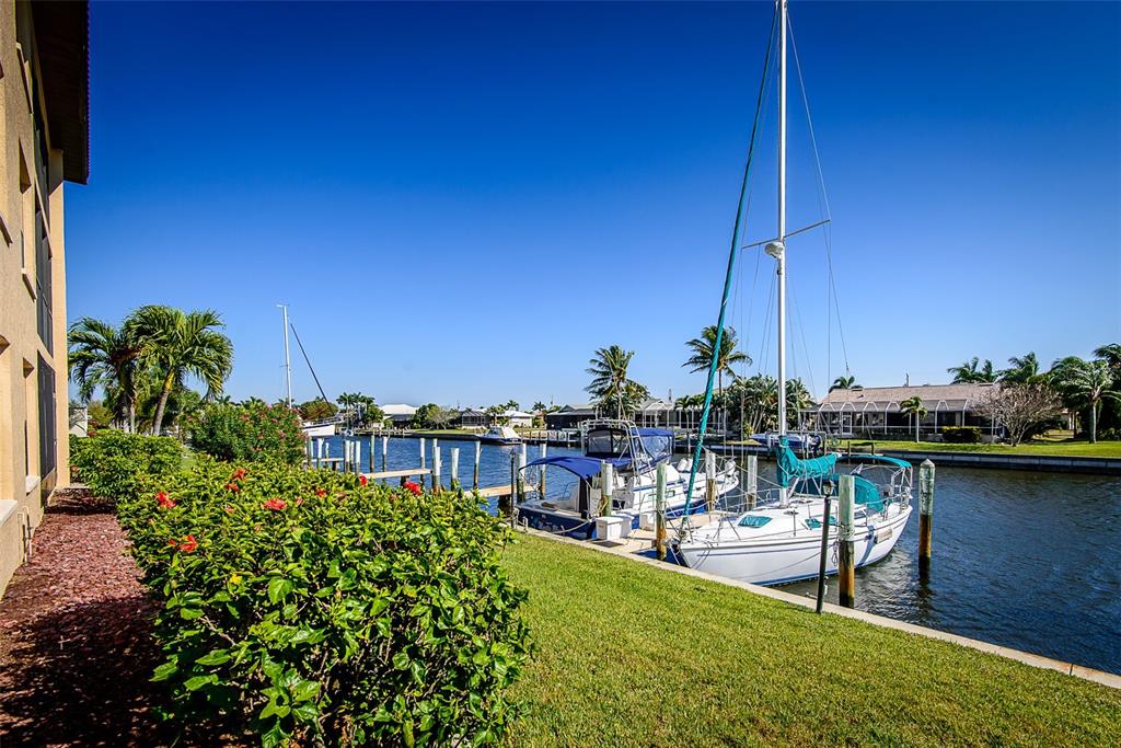 2601 West Marion Avenue, Unit 41C Punta Gorda, FL 33950 - Photo 3 of 43 a view of a lake with lawn chairs