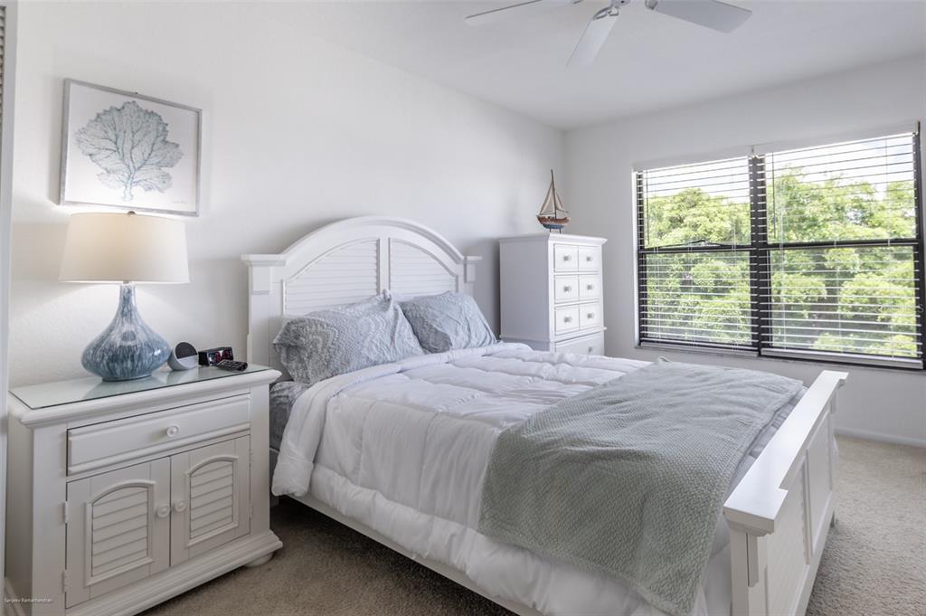 2601 West Marion Avenue, Unit 41C Punta Gorda, FL 33950 - Photo 34 of 43 a bedroom with a bed and a window