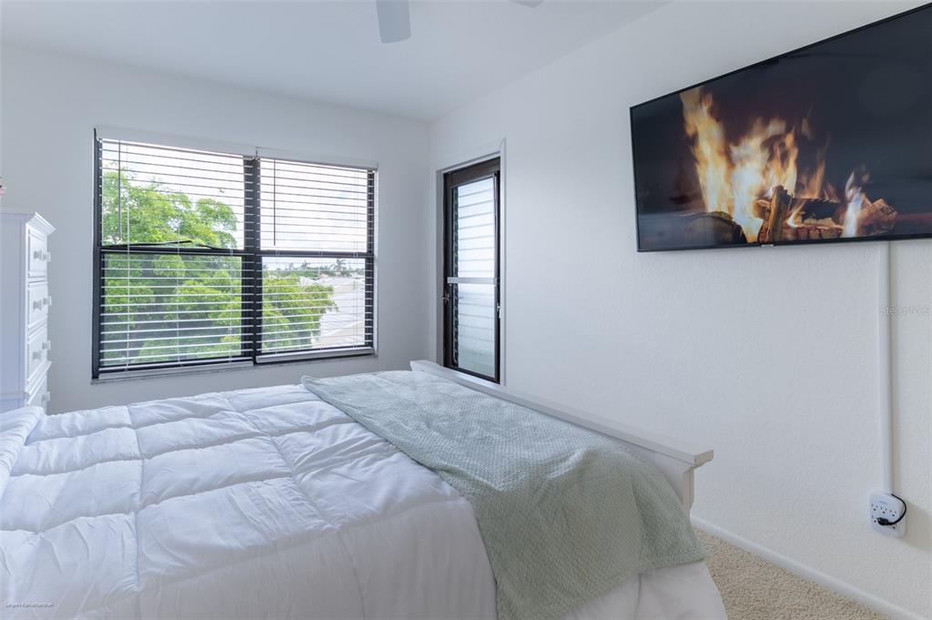 2601 West Marion Avenue, Unit 41C Punta Gorda, FL 33950 - Photo 35 of 43 a bed sitting in a bedroom next to a window