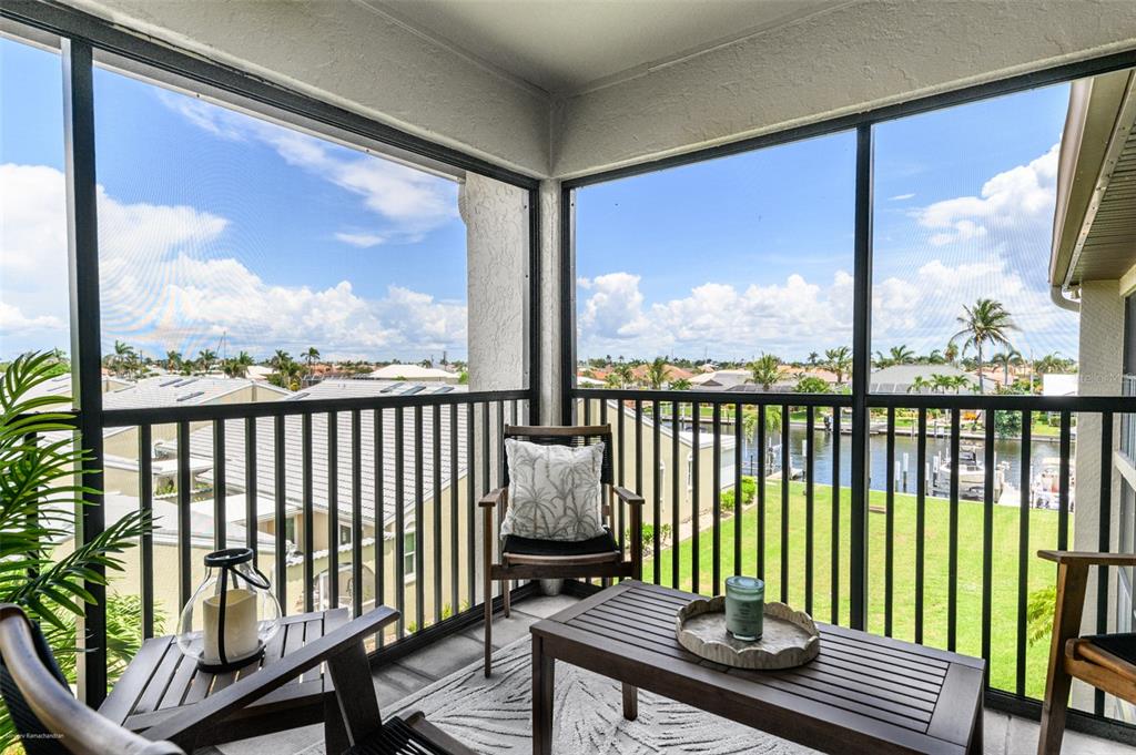2601 West Marion Avenue, Unit 41C Punta Gorda, FL 33950 - Photo 37 of 43 a view of a chair in wooden deck