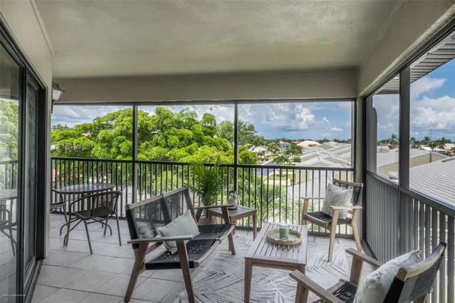 a view of a two chairs in the balcony