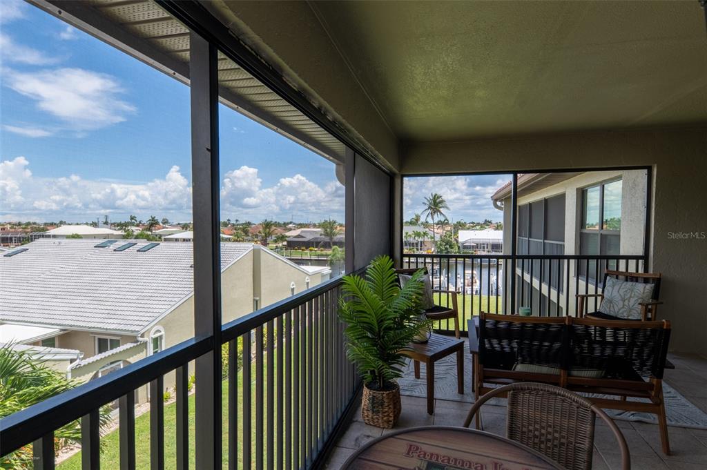 2601 West Marion Avenue, Unit 41C Punta Gorda, FL 33950 - Photo 39 of 43 a view of a two chairs in the balcony