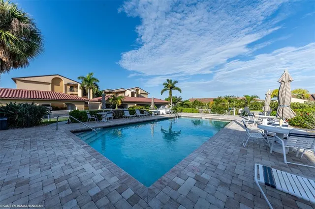a view of a swimming pool with a patio