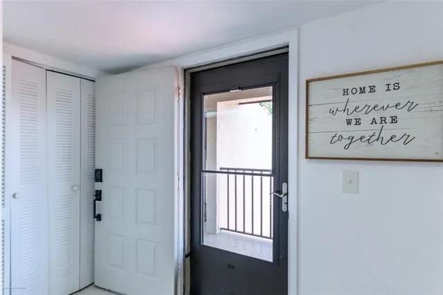 a kitchen with furniture and a window
