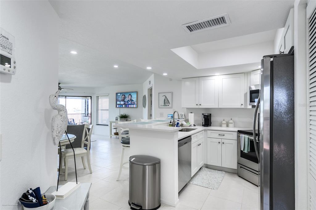2601 West Marion Avenue, Unit 41C Punta Gorda, FL 33950 - Photo 7 of 43 a kitchen with a sink stainless steel appliances and cabinets
