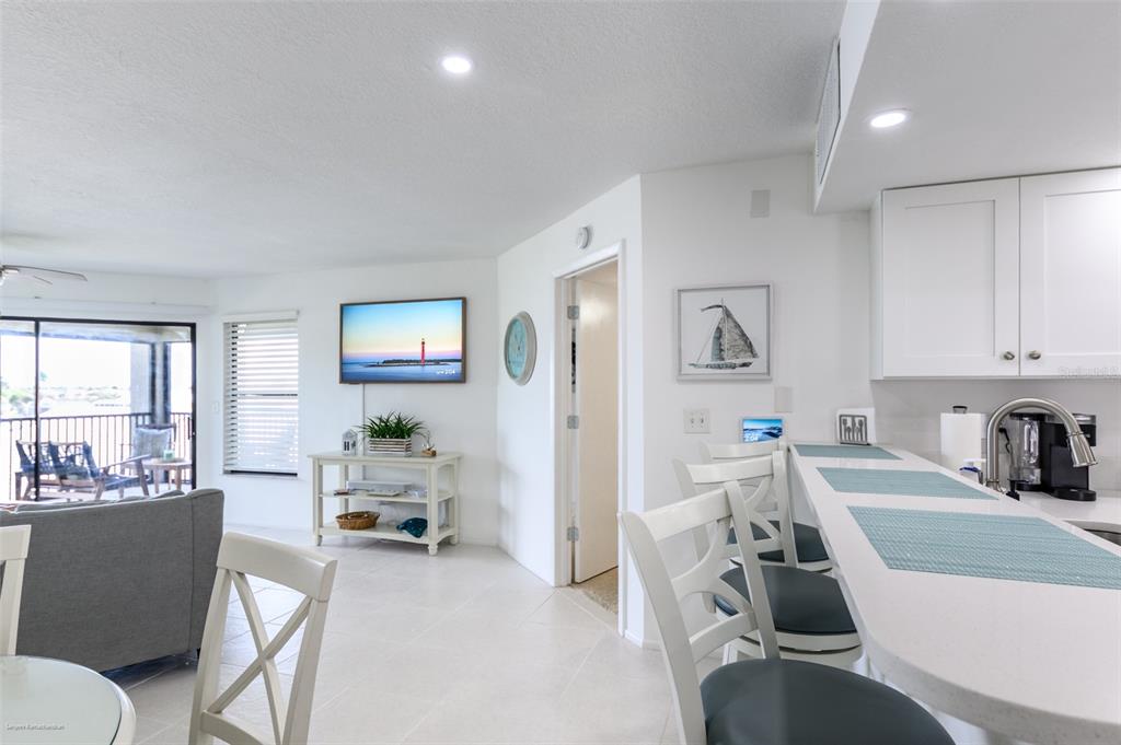 2601 West Marion Avenue, Unit 41C Punta Gorda, FL 33950 - Photo 10 of 43 a living room with furniture and a table