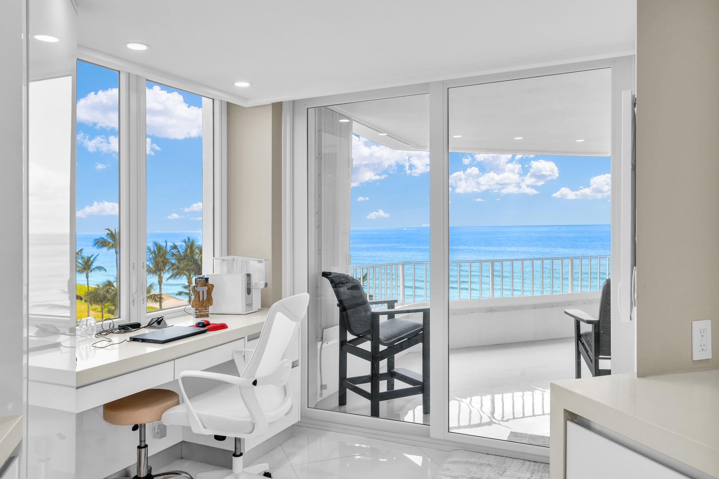 550 South Ocean Boulevard, Unit 605 Boca Raton, FL 33432 - Photo 12 of 51 a room with a large window and table