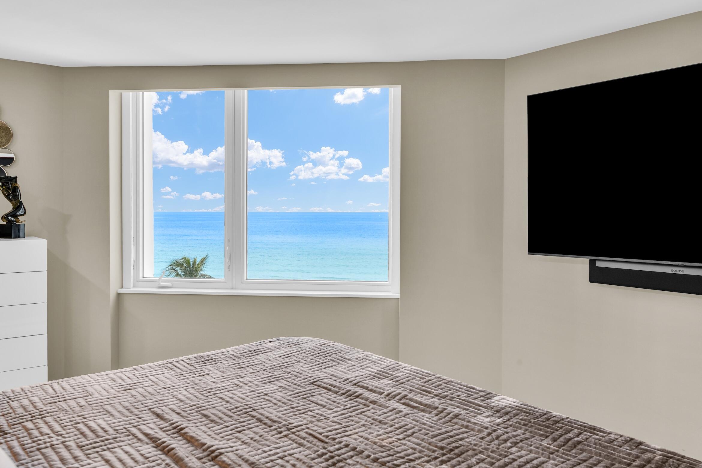 550 South Ocean Boulevard, Unit 605 Boca Raton, FL 33432 - Photo 20 of 51 a bedroom with a bed and a flat screen tv