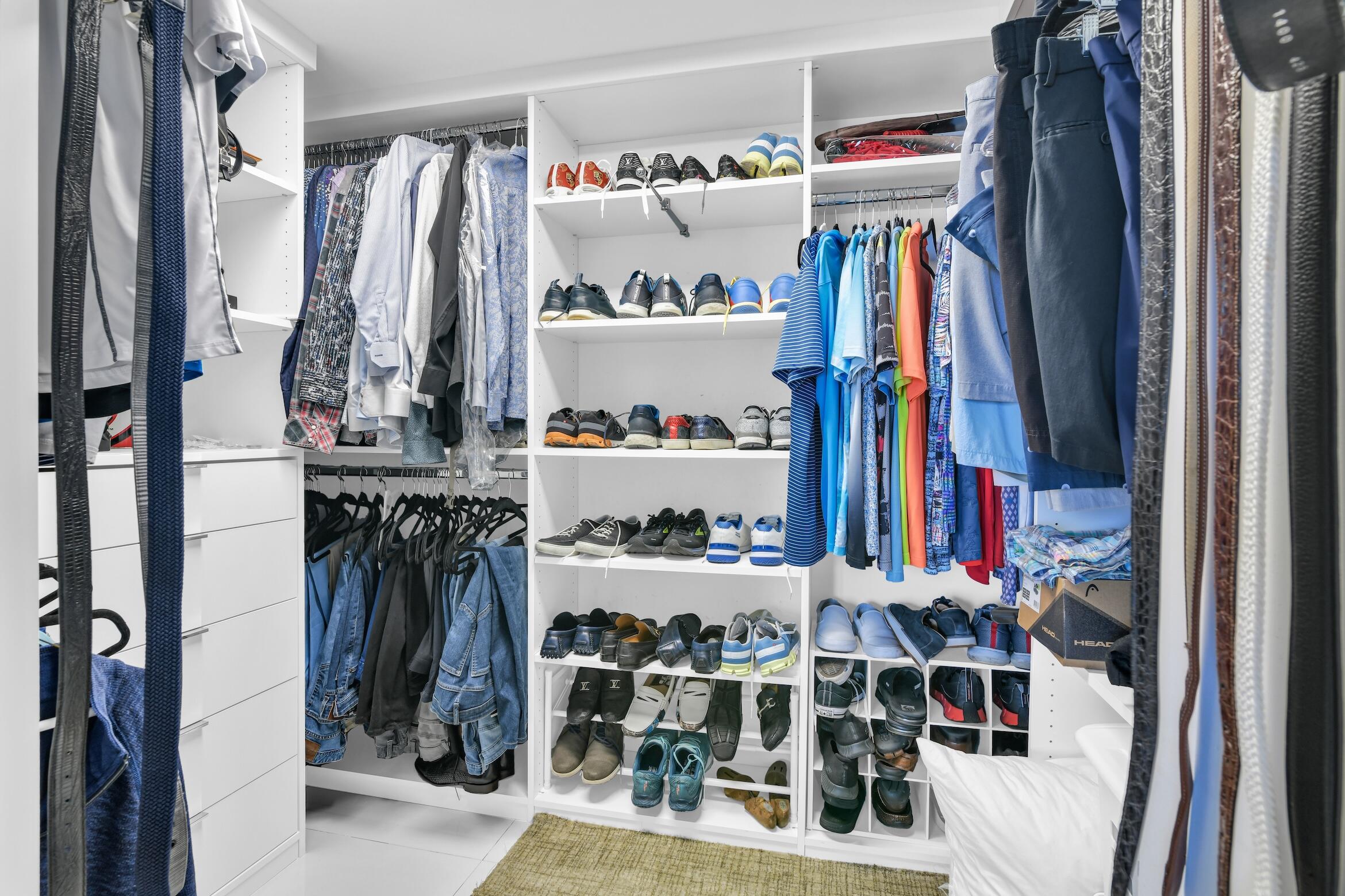 550 South Ocean Boulevard, Unit 605 Boca Raton, FL 33432 - Photo 24 of 51 a view of walk in closet with clothes and shoes