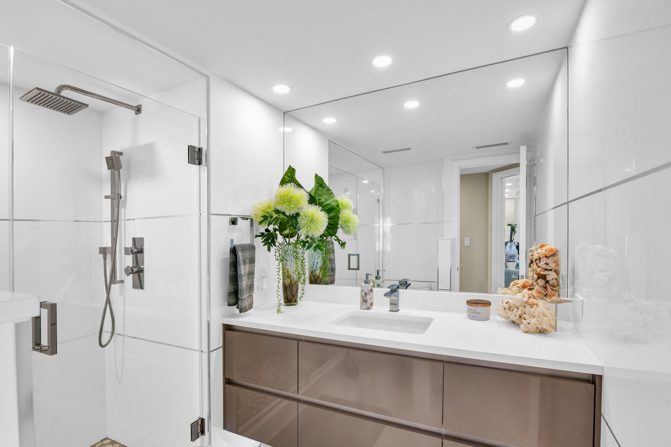 550 South Ocean Boulevard, Unit 605 Boca Raton, FL 33432 - Photo 27 of 51 a bathroom with a sink and a mirror