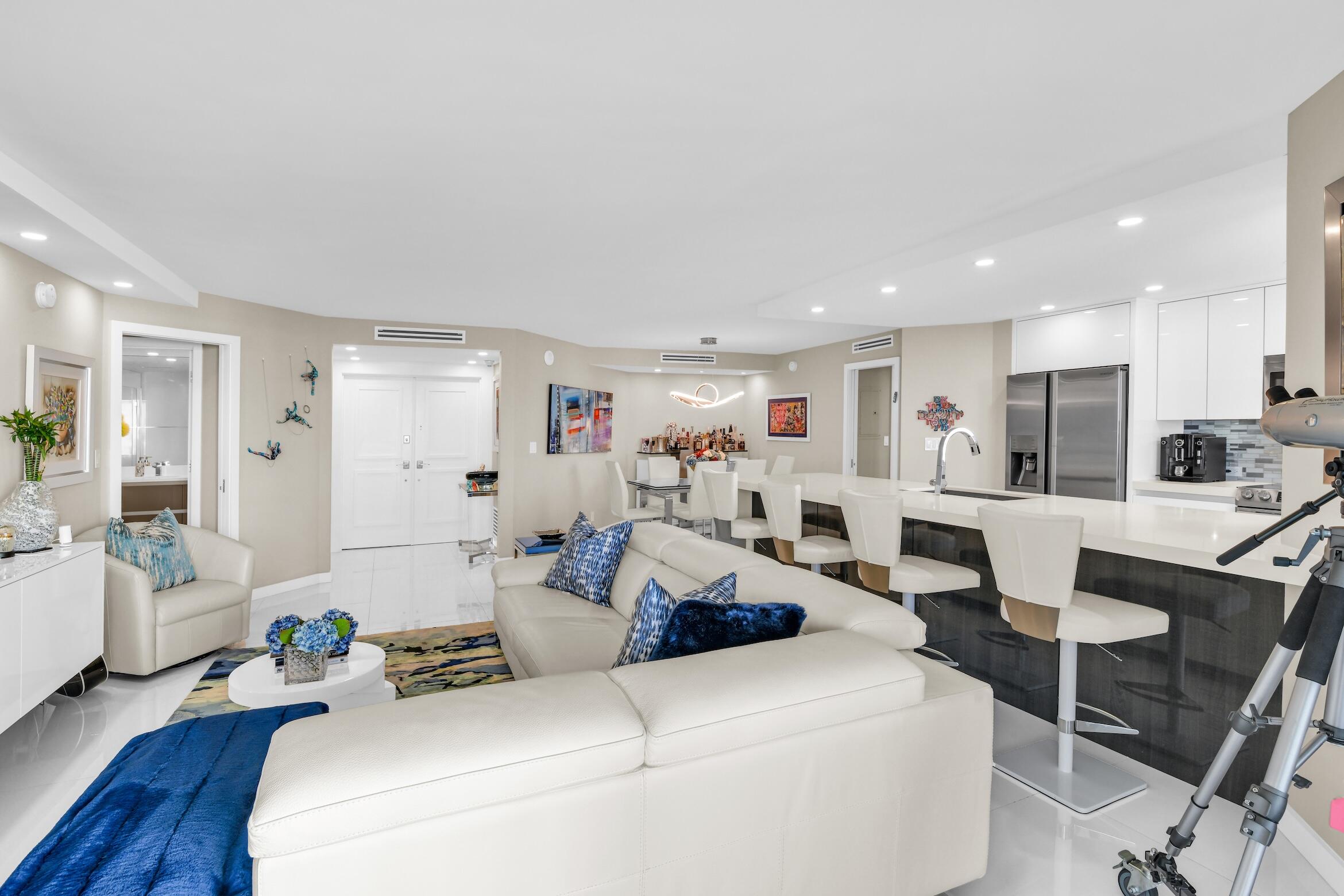 550 South Ocean Boulevard, Unit 605 Boca Raton, FL 33432 - Photo 4 of 51 a living room with furniture and a table