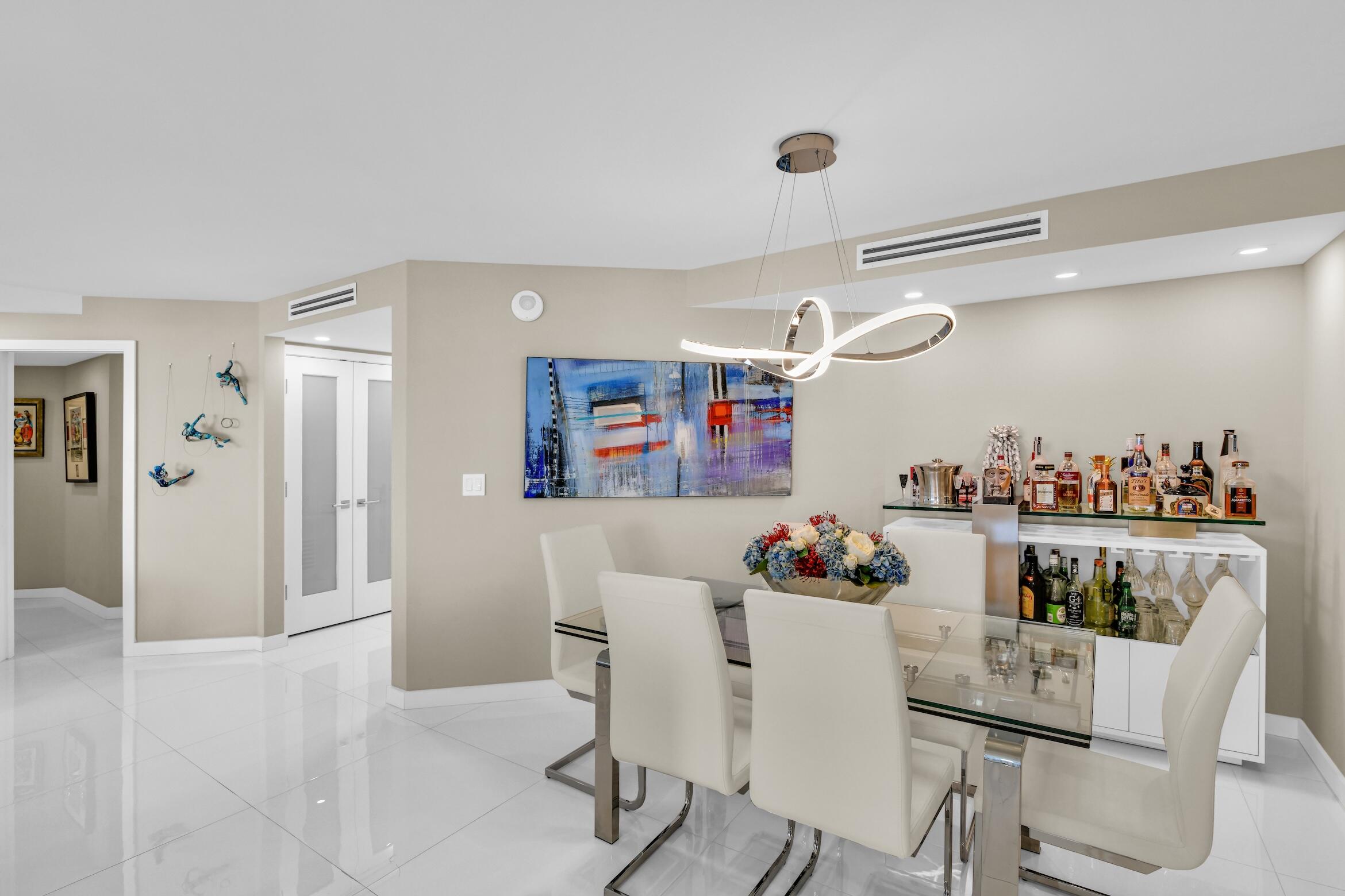 550 South Ocean Boulevard, Unit 605 Boca Raton, FL 33432 - Photo 6 of 51 a dining room with furniture and window