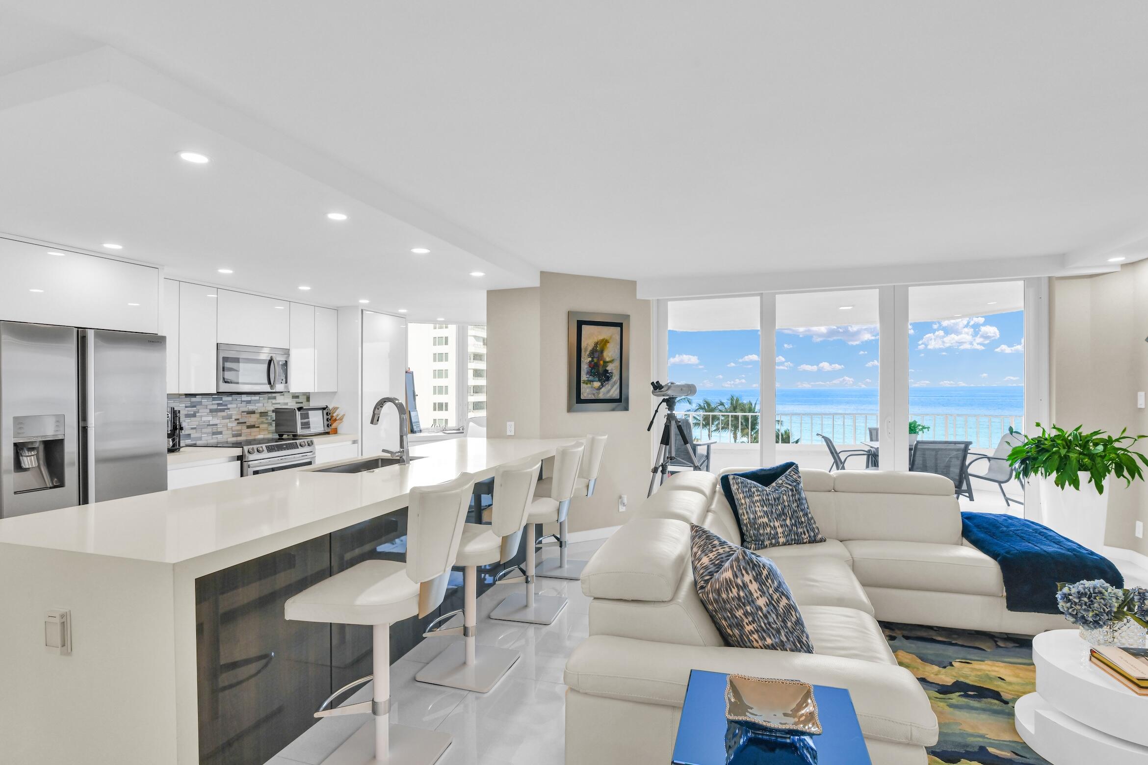 550 South Ocean Boulevard, Unit 605 Boca Raton, FL 33432 - Photo 10 of 51 a living room with furniture wooden floor and a large window
