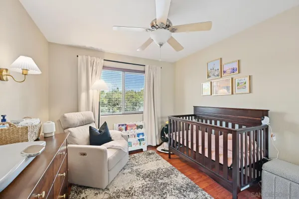 a bedroom with furniture and a large window