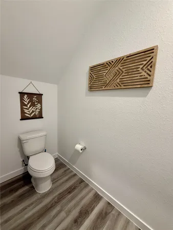 a bathroom with a toilet and a sink