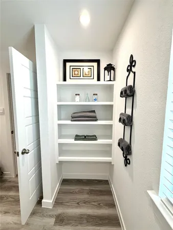 a view of staircase with white walls and a window