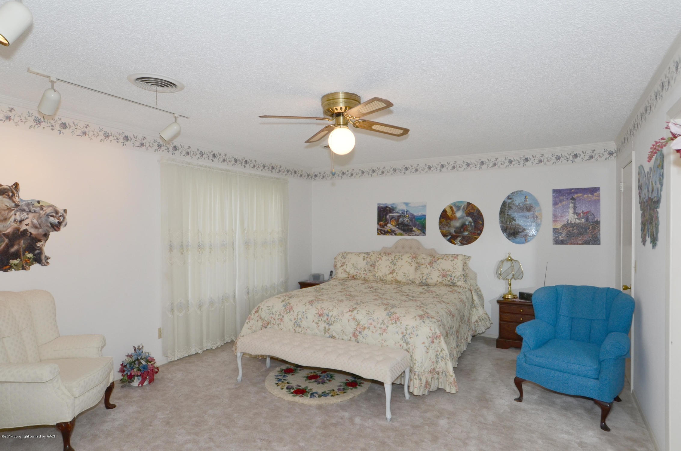 6507 Garwood Road Amarillo, TX 79109 - Photo 11 of 20 a living room with furniture and a chandelier