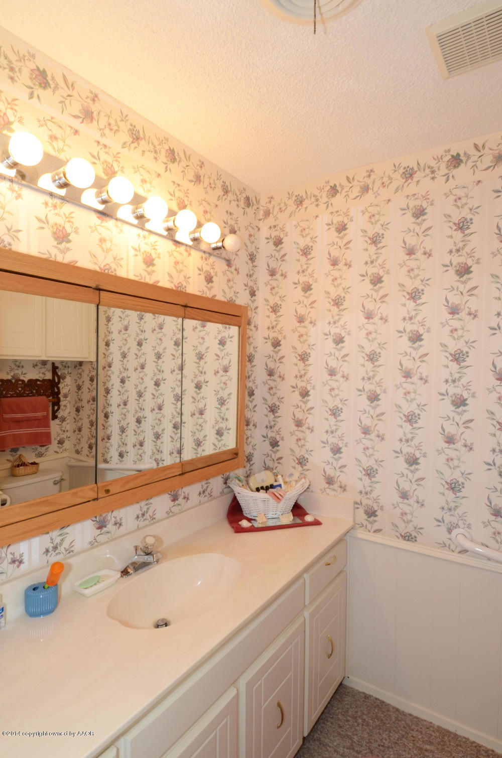 6507 Garwood Road Amarillo, TX 79109 - Photo 12 of 20 a bathroom with a sink and a window