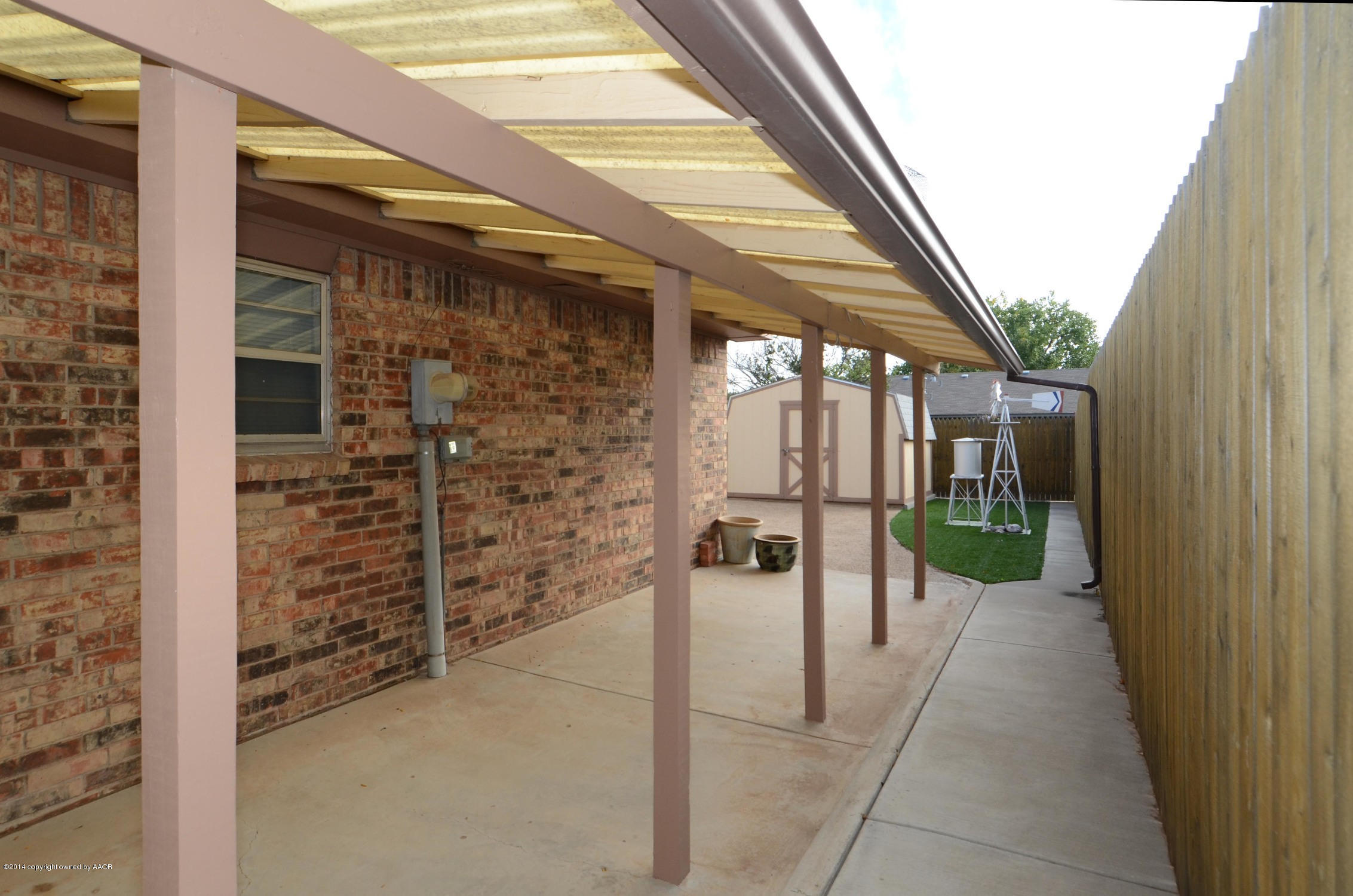 6507 Garwood Road Amarillo, TX 79109 - Photo 18 of 20 a view of water heater room with wooden floor