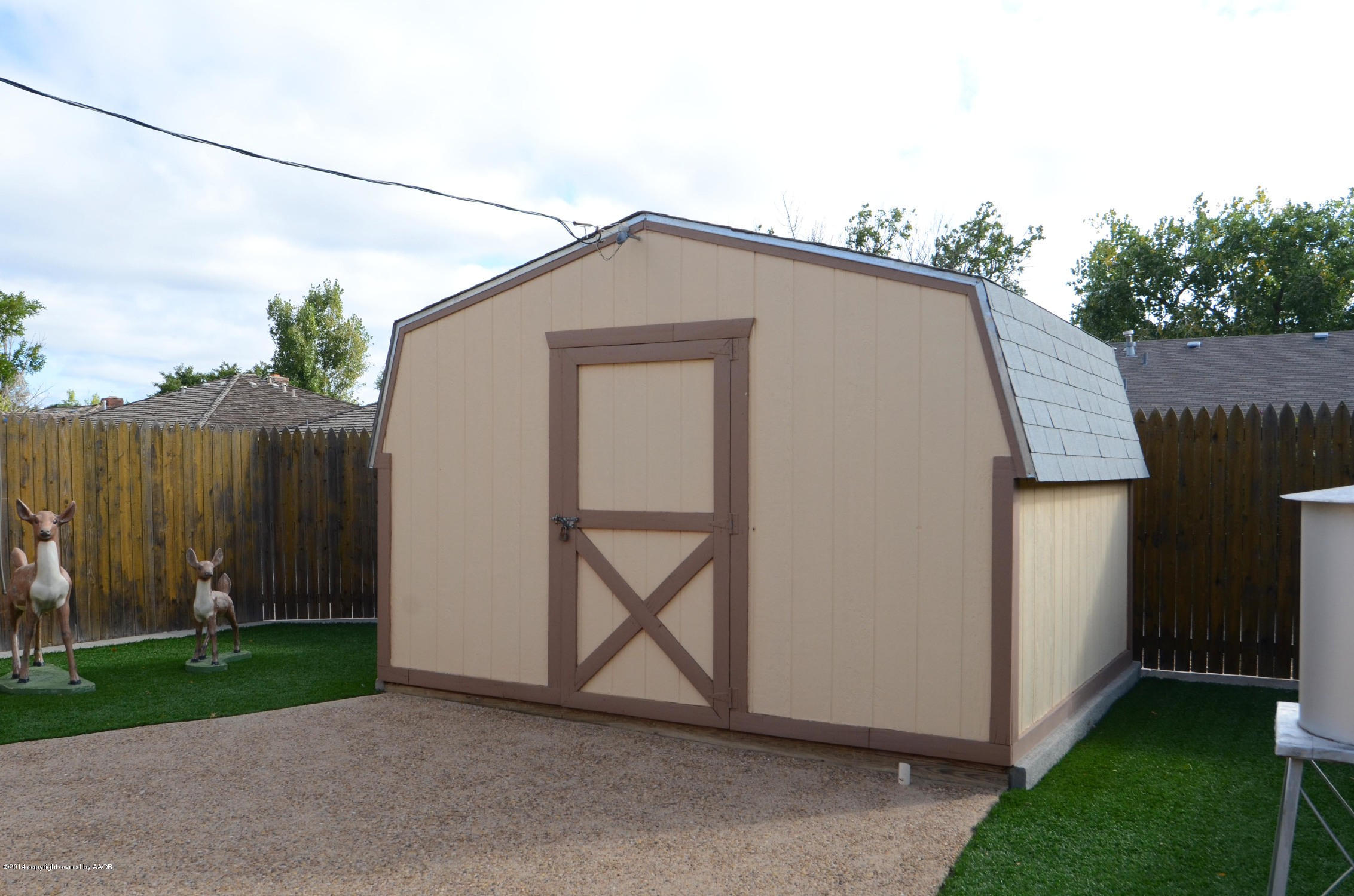 6507 Garwood Road Amarillo, TX 79109 - Photo 20 of 20 a backyard of a house with plants and wooden fence