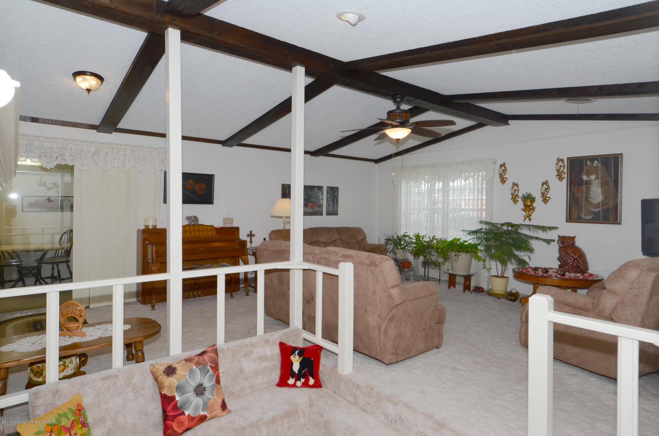 6507 Garwood Road Amarillo, TX 79109 - Photo 5 of 20 a living room with furniture and a flat screen tv