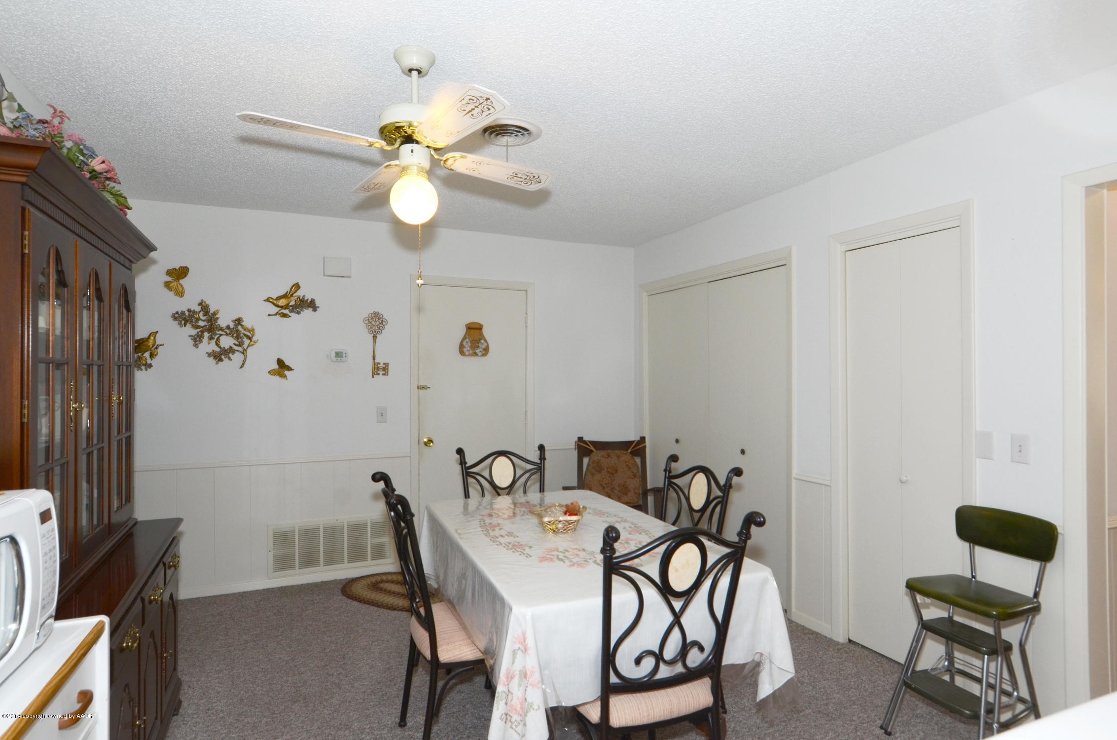 6507 Garwood Road Amarillo, TX 79109 - Photo 8 of 20 a view of a dining room with furniture and chandelier fan